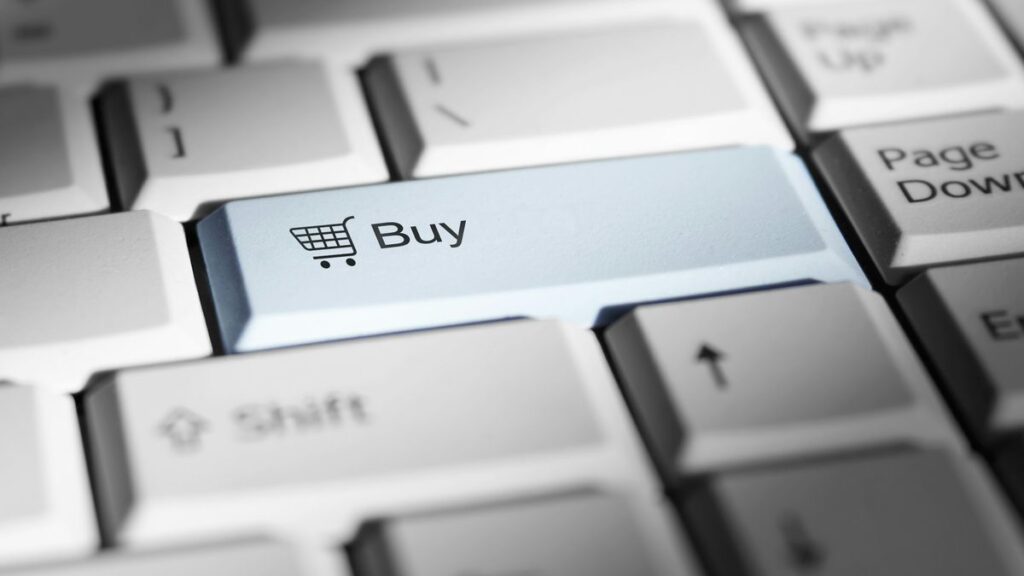 Close-up of a keyboard with a prominent 'buy' button